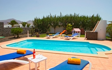 Outside, there's a beautiful garden with a heated pool and spa for relaxing in the sun.. pool1.jpg